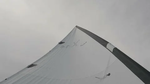 Full sail of a small sailboat on a windy day. Slow motion 4K Video stock 238904365