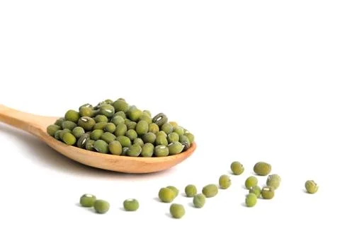 Full scoop of raw mung bean  mung seed on wooden spoon  isolated on a white b Stock Photos
