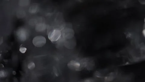 Full screen black silver bokeh video Stock Footage 318513442