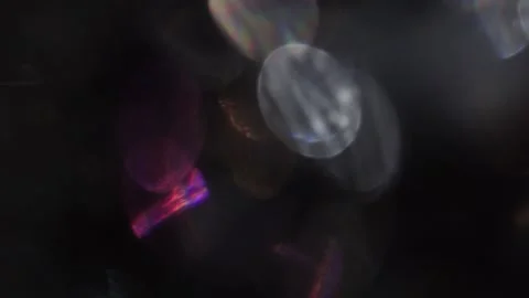 Full-screen colored crystal bokeh lights in black 库存影片 318663364