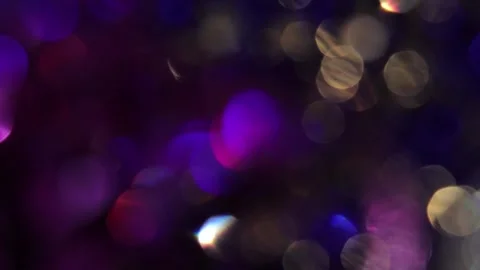 Full-screen golden and colored bokeh lights in black Видео 317534113