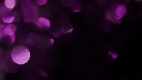 Full screen slow motion of purple bokeh glowing light Stock Footage 318943333