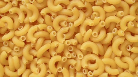 Full screen uncooked raw elbow macaroni Stock Footage 193994396