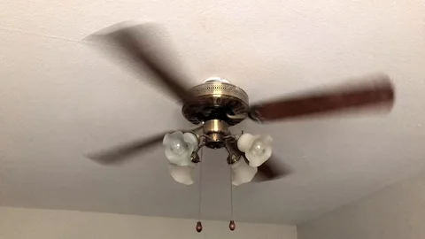Full shot of a 4 blade ceiling fan. Stock Footage 92564867