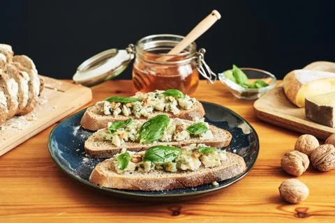Full shot and focus stacking on a plate of toasts with roquefort cheese Photos