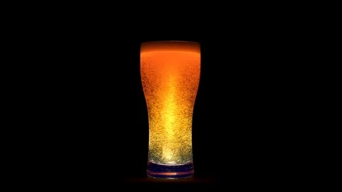 Full shot big glass of refreshing cold craft beer with many bubbles animation Stock Footage 103548198
