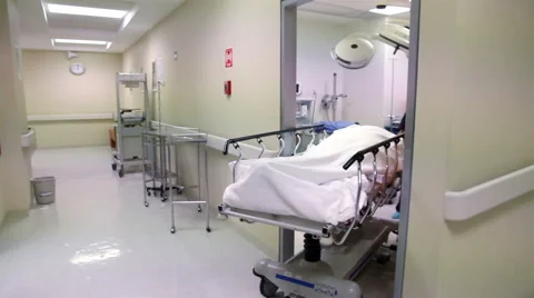 FULL SHOT-HANDHELD SHOT. Nursing staff and surgeons in a hospital corridor. Stock Footage 48946942