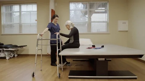 Full shot of an old woman using a walker 動画素材 71829406