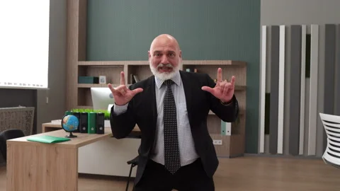 Full shot of solid Caucasian man in formal wear showing yes, victory gestures Stock Footage 249105343