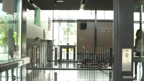 Full shot of student leaving school 動画素材 76567046