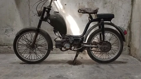 Full Shot of a Vintage Rusty Sachs Moped in a Garage Stock Footage 345311600