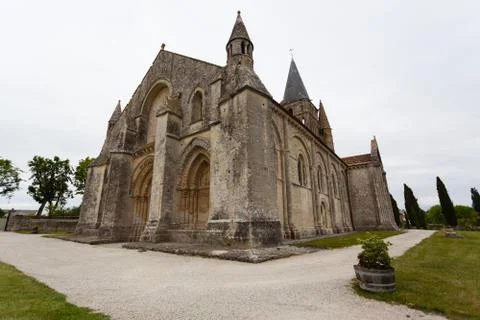 Full side  view of aulnay de saintonge church Stock Photos
