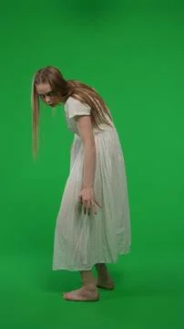 Full-size half turn vertical green screen, chroma key shot of a posessed female Stock Photos