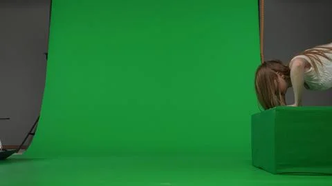 Full-size side view green screen chroma key shot of a posessed female, woman Foto stock