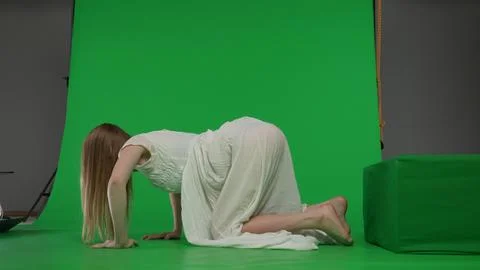 Full-size side view green screen chroma key shot of a posessed female, woman Stock Photos