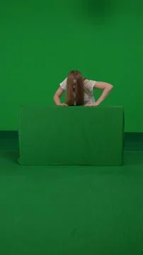 Full-size vertical green screen chroma key shot of a posessed female, woman Foto stock