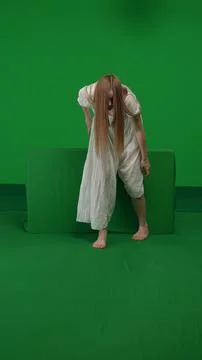 Full-size vertical green screen, chroma key shot of a posessed female, woman Stock Photos