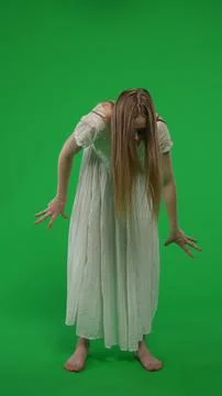 Full-size vertical green screen, chroma key shot of a posessed female, woman Fotos de archivo