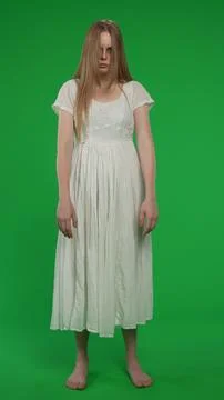 Full-size vertical green screen, chroma key shot of a posessed female, woman Foto stock