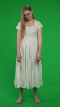 Full-size vertical green screen, chroma key shot of a posessed female, woman 스톡 사진