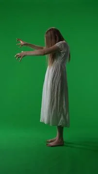 Full-size vertical side view green screen, chroma key shot of a posessed female Stock Photos