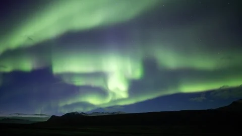 Full sky bright aurora borealis over mountain plain, Skaftafell Iceland Stock Footage 96937418
