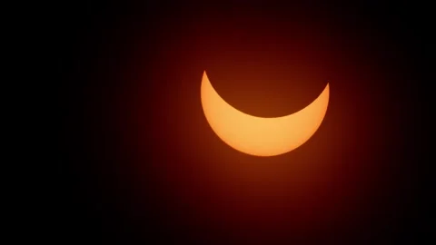 Full solar eclipse happening in real time afternoon at April 8 2024 Stock Footage 275751236