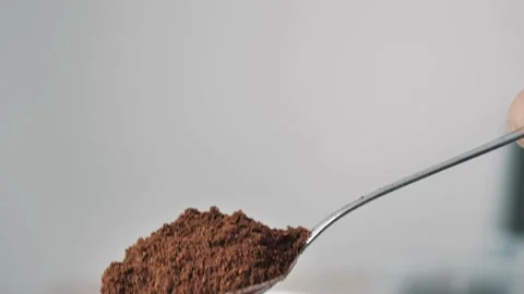 A full spoon of coffee. slow motion from spoon Stock Footage 220597023