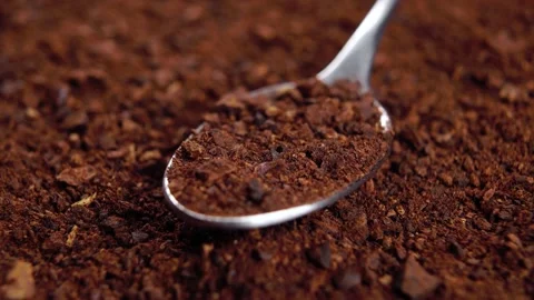Full teaspoon of soluble crushed dried chicory root on a heap of instant powd Stock Footage 166459224