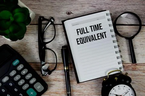 Full Time Equivalent (FTE) text on notepad, Business and Financial concept .. Stock Photos
