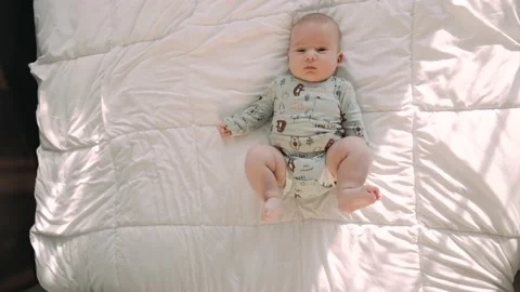 Full top down shot of beautiful two-month-old newborn baby child Stock Footage 165846836