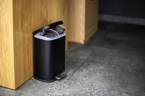 Full trash can not close in the office Stock Photos
