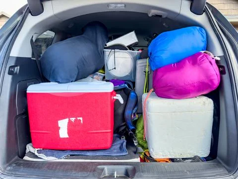Full van packed for a camping trip with the back open. Stock Photos