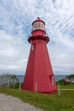 Full vertical view of a red lighthouse Stock Photos