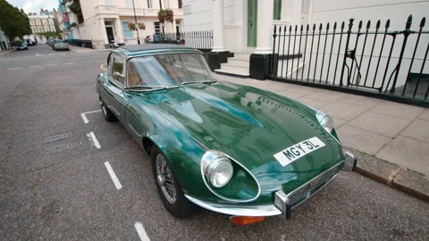 A full view of a classic Green Jaguar e type 1970 on London's streets in 4K. Stock Footage 139944604