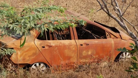 Full view of crashed car along the road, Rusted car footage Stock Footage 151835787
