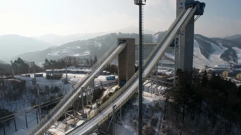 Full view of Pyeongchang Ski Jump Stadium, pov drone shot Stock Footage 106943326