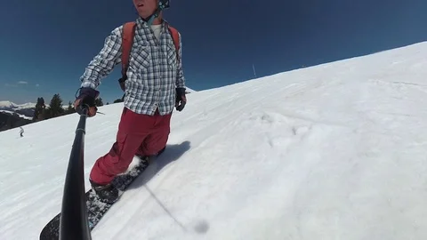 FullHD front-perspective snowboarding using a stabilised action cam on a pole Stock Footage 109466016
