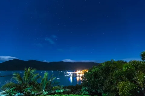 A fullmoon and clouds speed over Shute Harbour near the Great Barrier reef Stock Footage 119462588