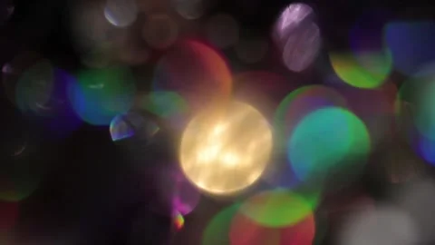 Fullscreen holiday background of seven sparkling colors bokeh on black 库存影片 317457452