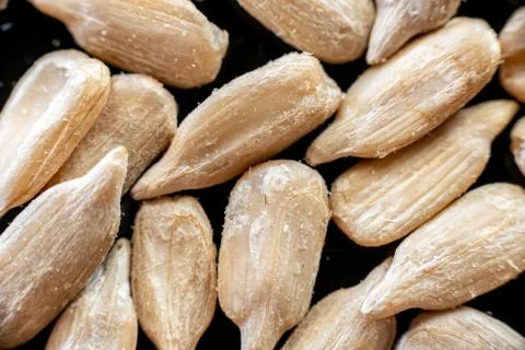 Fullscreen macro closeup with shallow depth of field of sunflower seeds on a  Stock Photos