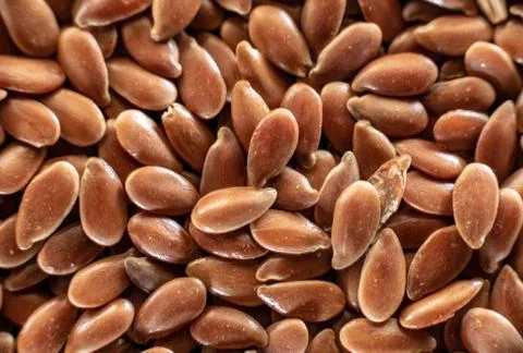 Fullscreen macro closeup with shallow depth of field of flax seed. Texture. G Stock Photos