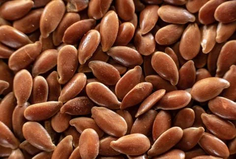 Fullscreen macro closeup with shallow depth of field of flax seed. Texture. G Stock Photos
