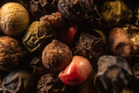 Fullscreen macro closeup with shallow depth of field of unmilled red, green,  Stock Photos