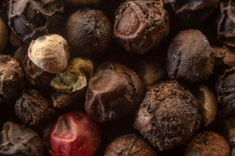 Fullscreen macro closeup with shallow depth of field of unmilled red, green,  Stock Photos