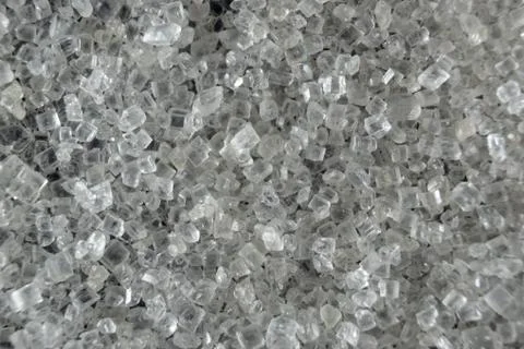 Fullscreen macro closeup with shallow depth of field of small sugar grains on Stock Photos