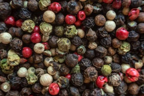 Fullscreen macro closeup with shallow depth of field of unmilled red, green,  Stock Photos