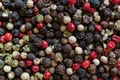 Fullscreen macro closeup with shallow depth of field of unmilled red, green,  Stock Photos