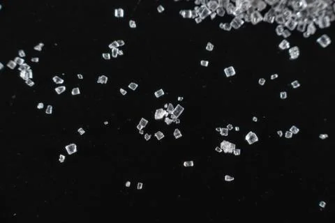 Fullscreen macro closeup with shallow depth of field of small sugar grains on Stock Photos