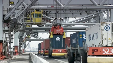 Fully automatic electric logistic system, cargo crane unloads autonomous Stock Footage 239378928